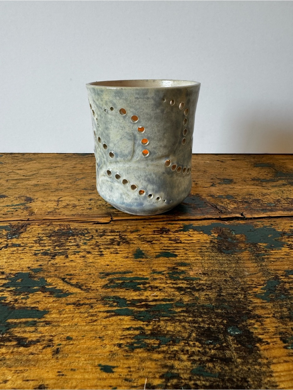 Handcrafted Gray Ceramic Votive Holder with Perforated Design
